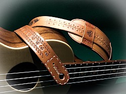 Decorated Ukulele strap using stamps and laser engraving.