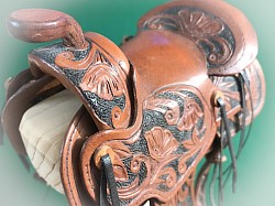 Mini saddle hand carved.
